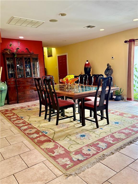 402 28th St, New Orleans, LA 70124 - dining area featuring tile patterned floors and recessed lighting