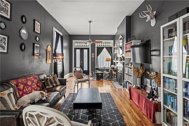 230406 Valmont St, New Orleans, LA 70115 - living area featuring wood finished floors and a ceiling fan