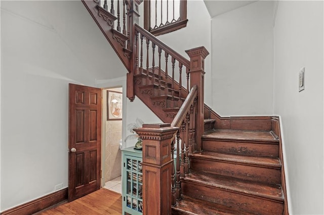 230406 Valmont St, New Orleans, LA 70115 - staircase featuring wood finished floors and baseboards