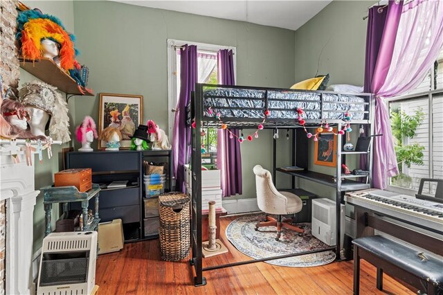 230406 Valmont St, New Orleans, LA 70115 - bedroom featuring hardwood / wood-style flooring and heating unit