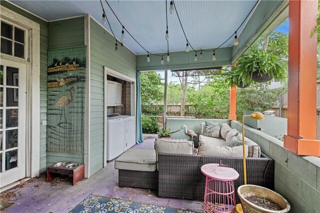 230406 Valmont St, New Orleans, LA 70115 - sunroom with washing machine and dryer, an outdoor hangout area, and plenty of natural light