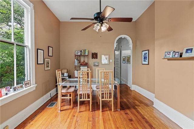 230406 Valmont St, New Orleans, LA 70115 - dining area with healthy amount of natural light, ceiling fan, light wood finished floors, and a high ceiling