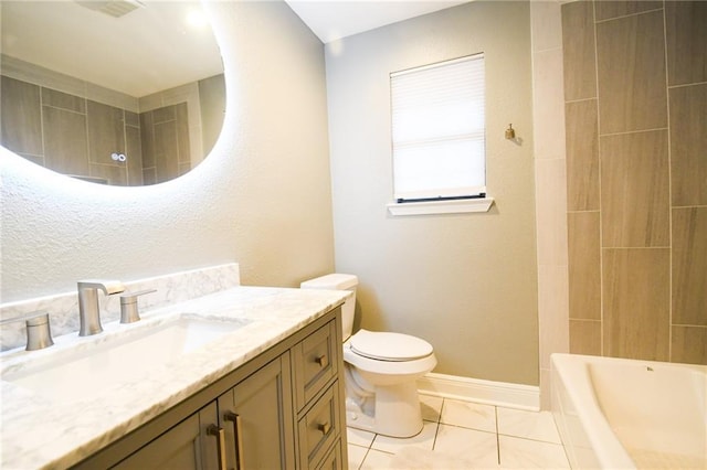 bathroom featuring toilet, vanity, and baseboards