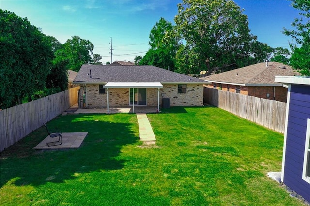 rear view of house featuring brick siding, a patio, and central AC