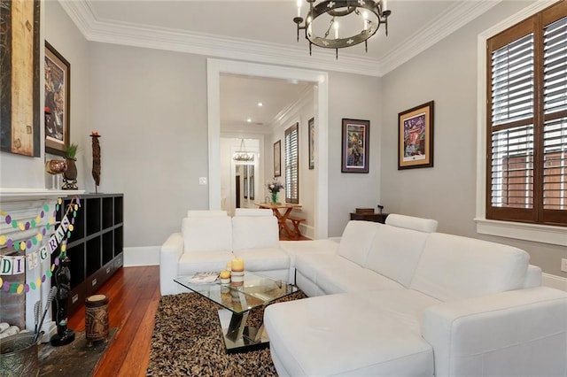 2026 Camp St, New Orleans, LA 70130 - living room with a chandelier, dark wood-type flooring, plenty of natural light, baseboards, and ornamental molding