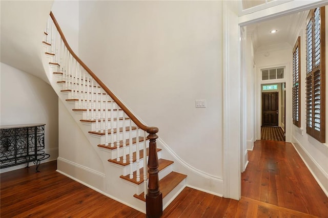 2026 Camp St, New Orleans, LA 70130 - staircase featuring hardwood / wood-style floors, baseboards, and recessed lighting