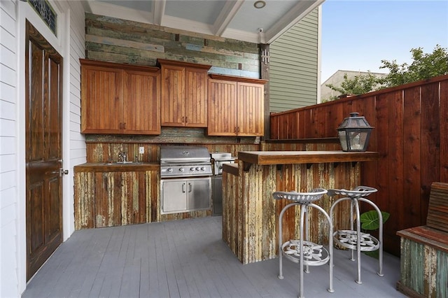 2026 Camp St, New Orleans, LA 70130 - view of patio with a grill, a deck, and a sink