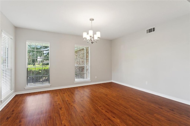 3604 Meadow Lake Dr W, Slidell, LA 70461 - spare room with a chandelier, baseboards, and wood finished floors