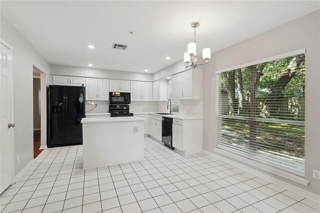 3604 Meadow Lake Dr W, Slidell, LA 70461 - kitchen with black appliances, healthy amount of natural light, light countertops, a chandelier, and recessed lighting