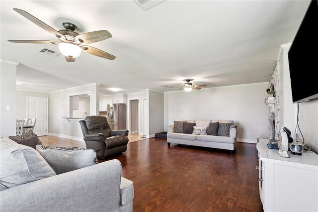 511 Gassen St, Luling, LA 70070 - living area featuring ceiling fan, ornamental molding, dark wood-style floors, and baseboards