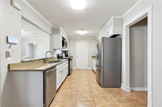 511 Gassen St, Luling, LA 70070 - kitchen featuring appliances with stainless steel finishes, a sink, white cabinetry, crown molding, and light stone counters