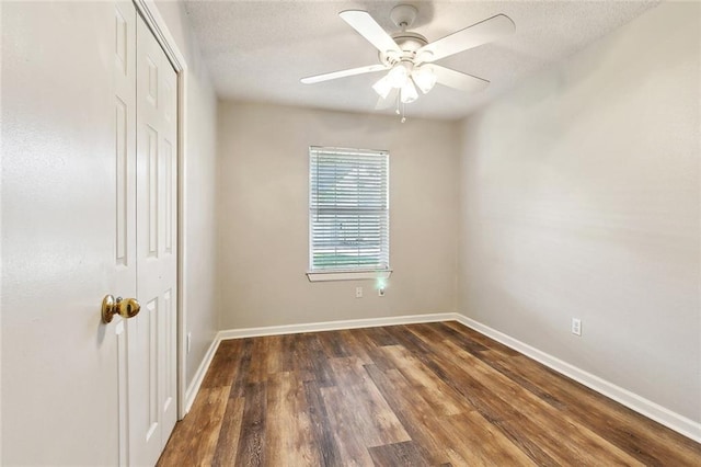 511 Gassen St, Luling, LA 70070 - unfurnished bedroom with a closet, wood finished floors, baseboards, a ceiling fan, and a textured ceiling
