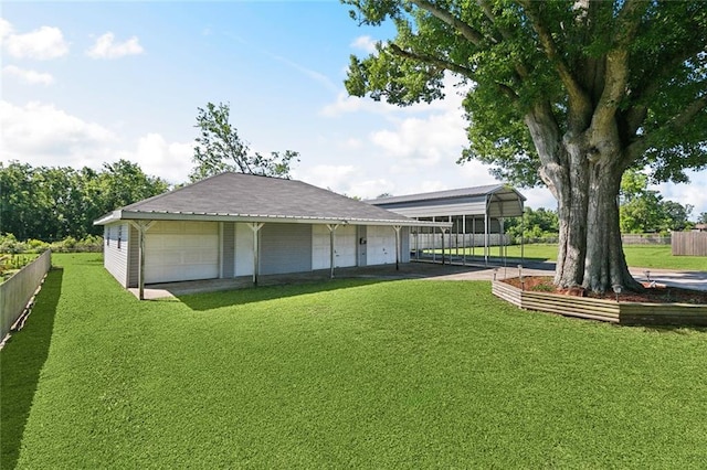 511 Gassen St, Luling, LA 70070 - rear view of property featuring a garage and an outbuilding
