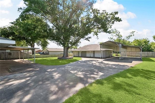 511 Gassen St, Luling, LA 70070 - view of front of house with asphalt driveway and a detached carport