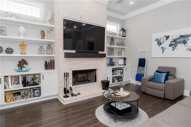 201 Jardin Loop, Covington, LA 70433 - living area featuring dark wood-type flooring, a brick fireplace, plenty of natural light, crown molding, and built in features