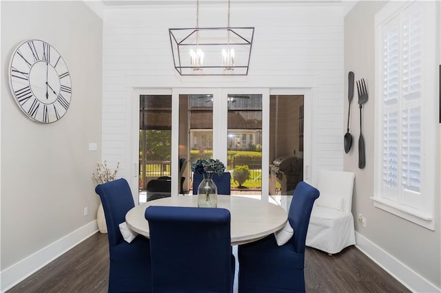 201 Jardin Loop, Covington, LA 70433 - dining area featuring dark wood-type flooring, a chandelier, and baseboards