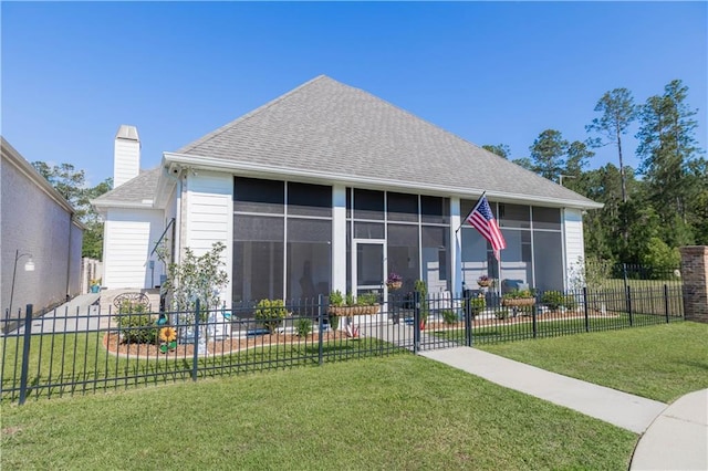 201 Jardin Loop, Covington, LA 70433 - back of property featuring a sunroom, roof with shingles, and a chimney