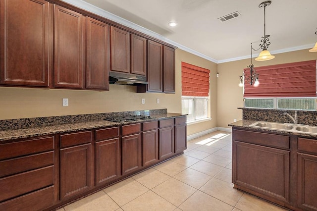 1134 Belair Blvd, Slidell, LA 70460 - kitchen featuring gas cooktop, under cabinet range hood, a sink, light tile patterned floors, and ornamental molding