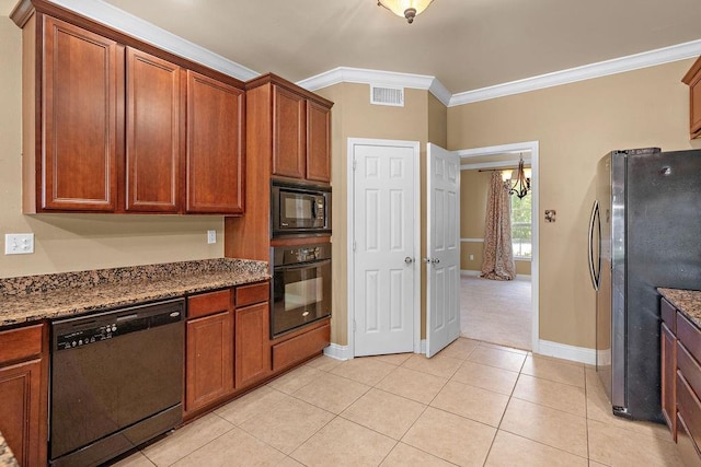 1134 Belair Blvd, Slidell, LA 70460 - kitchen with black appliances, crown molding, baseboards, light tile patterned flooring, and dark stone counters
