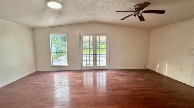 spare room featuring a ceiling fan, a textured ceiling, wood finished floors, french doors, and vaulted ceiling