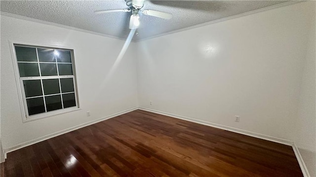 unfurnished room featuring dark wood finished floors, ceiling fan, a textured ceiling, and baseboards