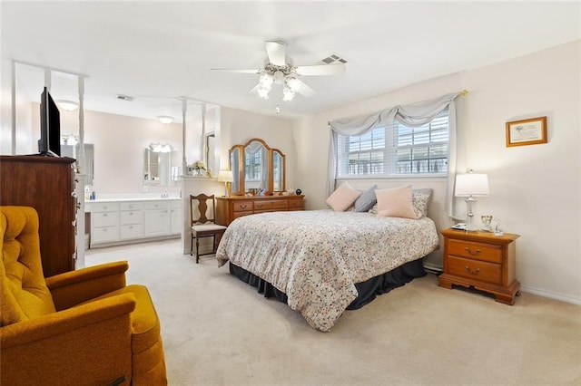 3117 Texas Ave, Kenner, LA 70065 - bedroom with light carpet, a ceiling fan, ensuite bathroom, and baseboards