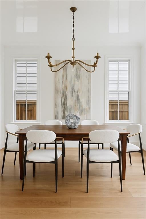 3804 Prytania St, New Orleans, LA 70115 - dining space featuring light wood-style flooring, a chandelier, and breakfast area
