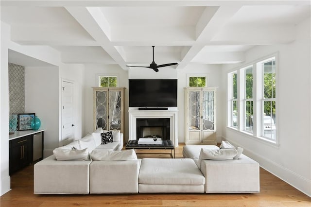 3804 Prytania St, New Orleans, LA 70115 - living area featuring a ceiling fan, coffered ceiling, wood finished floors, beamed ceiling, and a fireplace