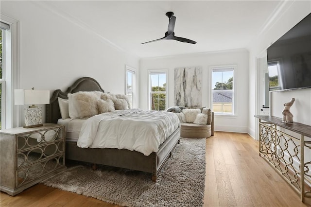 3804 Prytania St, New Orleans, LA 70115 - bedroom with light wood-type flooring, crown molding, ceiling fan, and baseboards