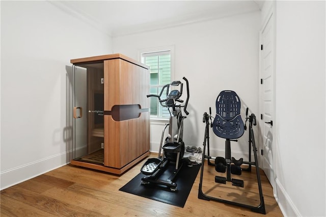 3804 Prytania St, New Orleans, LA 70115 - exercise room featuring wood finished floors, baseboards, and ornamental molding
