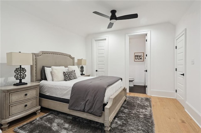 3804 Prytania St, New Orleans, LA 70115 - bedroom with wood finished floors, ensuite bath, baseboards, and ceiling fan