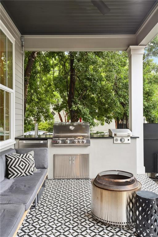 3804 Prytania St, New Orleans, LA 70115 - view of patio / terrace with grilling area, exterior kitchen, and ceiling fan