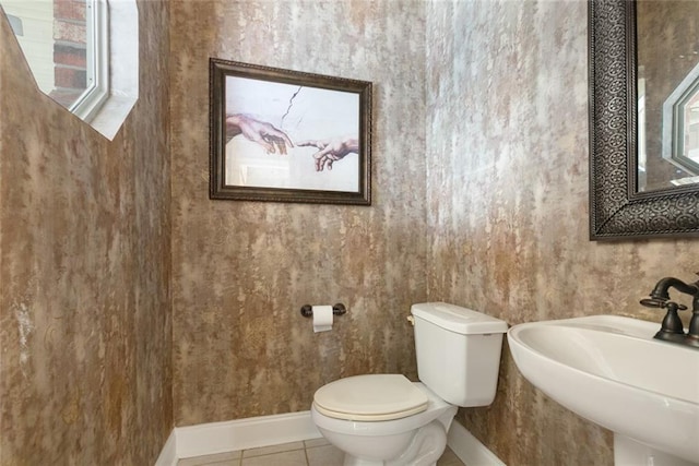 1057 Mariners Cove Blvd, Slidell, LA 70458 - bathroom with a sink, baseboards, toilet, and tile patterned floors