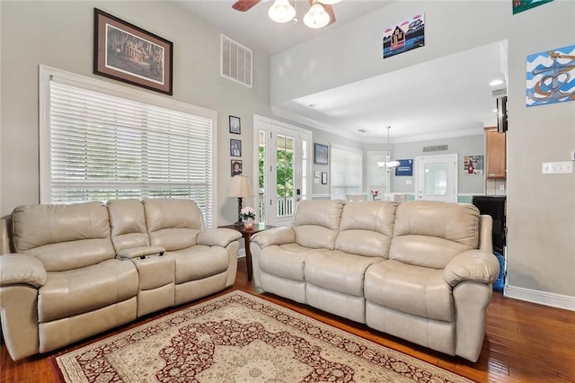 5 Rhonda Ct, Covington, LA 70433 - living room with wood finished floors, baseboards, ceiling fan, and crown molding