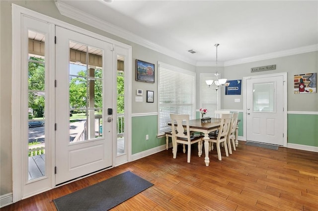 5 Rhonda Ct, Covington, LA 70433 - dining area featuring a chandelier, healthy amount of natural light, baseboards, and ornamental molding