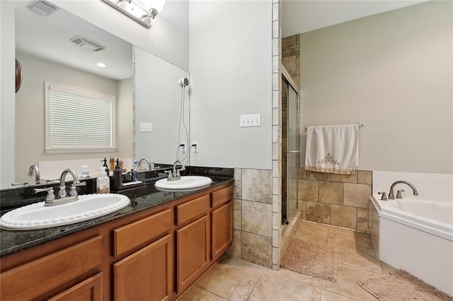 5 Rhonda Ct, Covington, LA 70433 - full bathroom featuring a stall shower, a bath, double vanity, and tile patterned flooring