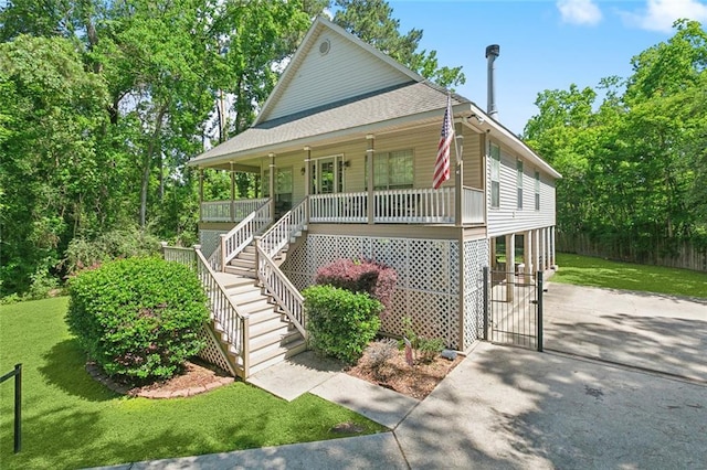 5 Rhonda Ct, Covington, LA 70433 - view of front of house with covered porch, stairway, driveway, and a gate