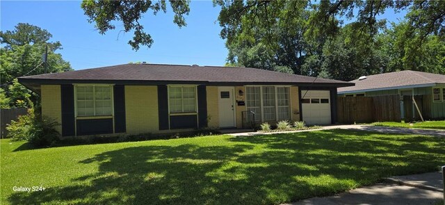 6133 Carlisle Ct, New Orleans, LA 70131 - single story home with a garage, driveway, and brick siding