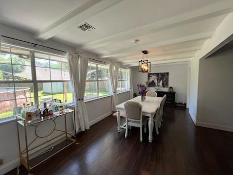 6133 Carlisle Ct, New Orleans, LA 70131 - dining space with beamed ceiling and dark wood-style floors