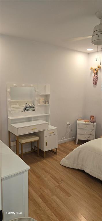 6133 Carlisle Ct, New Orleans, LA 70131 - bedroom with light wood finished floors and baseboards