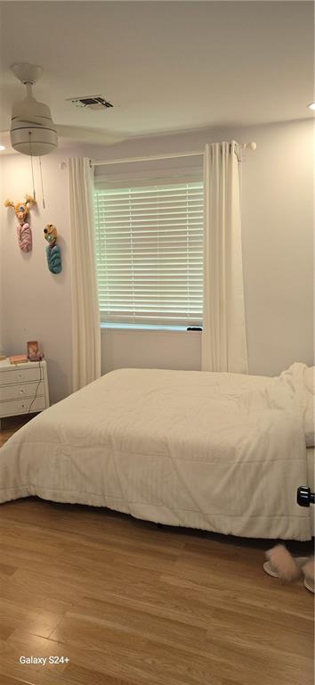 6133 Carlisle Ct, New Orleans, LA 70131 - bedroom featuring wood finished floors