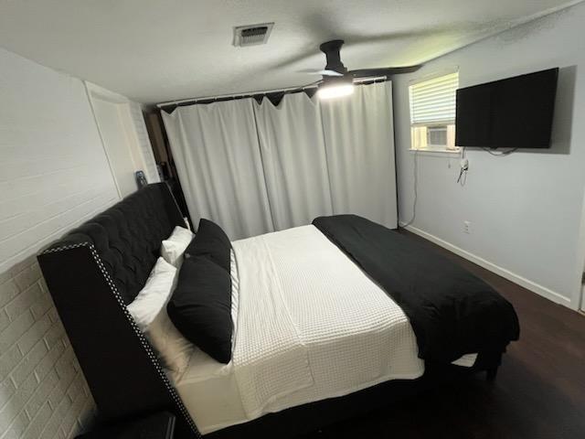 6133 Carlisle Ct, New Orleans, LA 70131 - bedroom with a ceiling fan, baseboards, and cooling unit