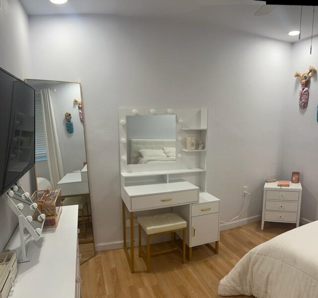 6133 Carlisle Ct, New Orleans, LA 70131 - bedroom with light wood-style floors