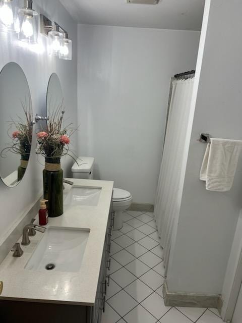 6133 Carlisle Ct, New Orleans, LA 70131 - full bath with toilet, tile patterned floors, double vanity, and curtained shower