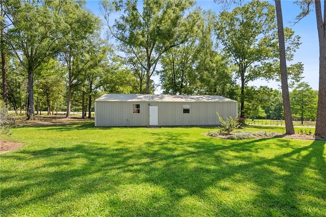 61180 Doe Run Dr, Amite, LA 70422 - view of grassy yard with a pole building and an outbuilding