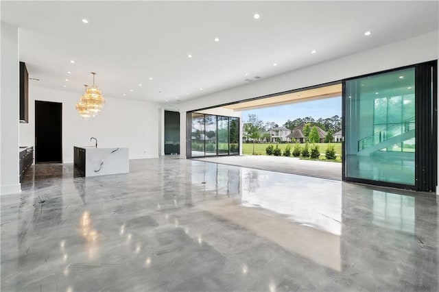 67 Hummingbird Rd, Covington, LA 70433 - empty room featuring recessed lighting and a chandelier