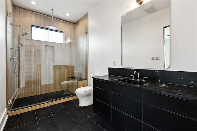 67 Hummingbird Rd, Covington, LA 70433 - bathroom with tile patterned flooring, vanity, toilet, a walk in shower, and recessed lighting