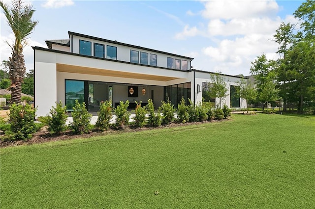 67 Hummingbird Rd, Covington, LA 70433 - rear view of property featuring stucco siding and a lawn