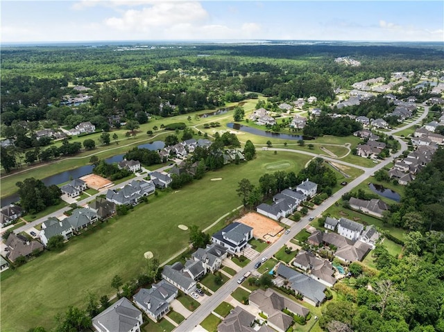 67 Hummingbird Rd, Covington, LA 70433 - aerial view of property and surrounding area featuring nearby suburban area, a large body of water, and a local golf course