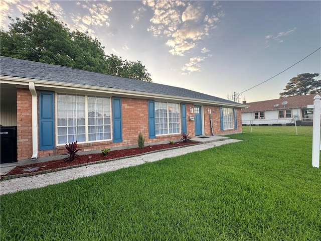 839 Behrman Ave, New Orleans, LA 70114 - ranch-style home with a front lawn and brick siding